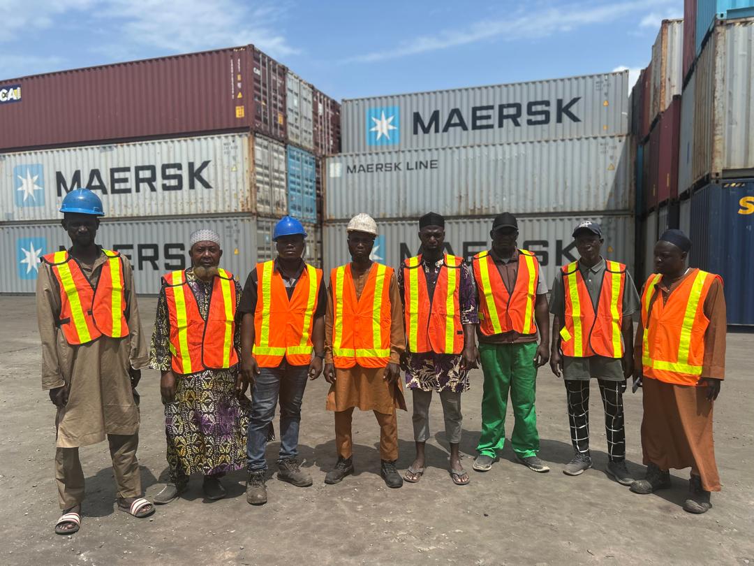 Yah Saalam Terminal Crew with Stacked Maersk Containers