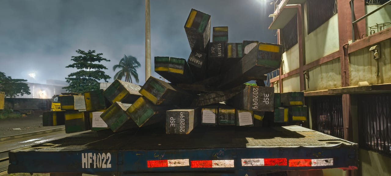 Steel loaded on flatbed trucks
